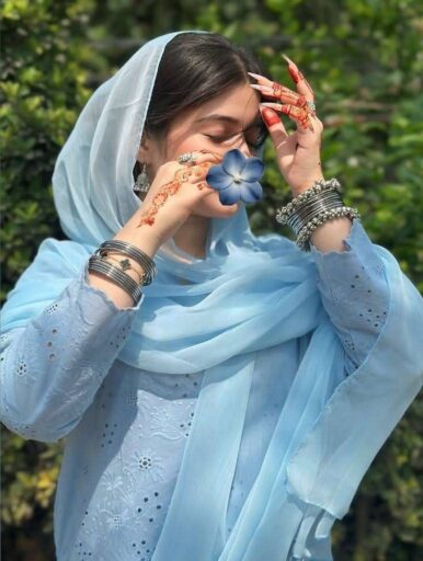 beautiful girl dp hiding her lips with flowers