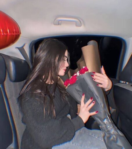 girl in car holding bouquet in her hand,new pfp