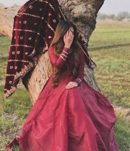 girl sitting on tree at photography style pic