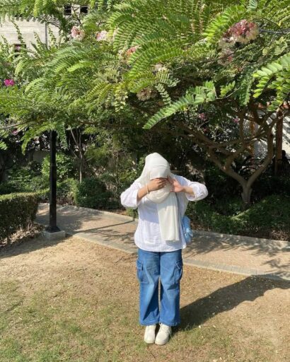 image of islamic girl in hijab standing in face hidding style